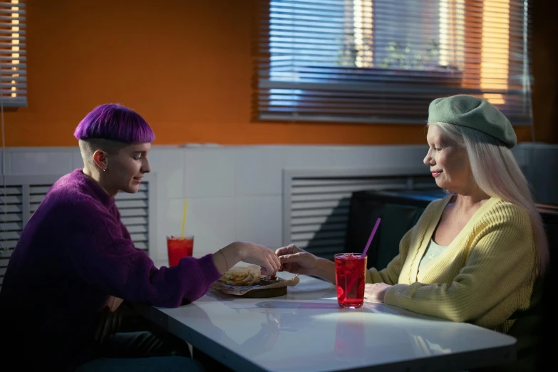 a couple of women sitting at a table, by Harriet Zeitlin, pexels, photorealism, she has purple hair, promotional movie still, fluorescent, square