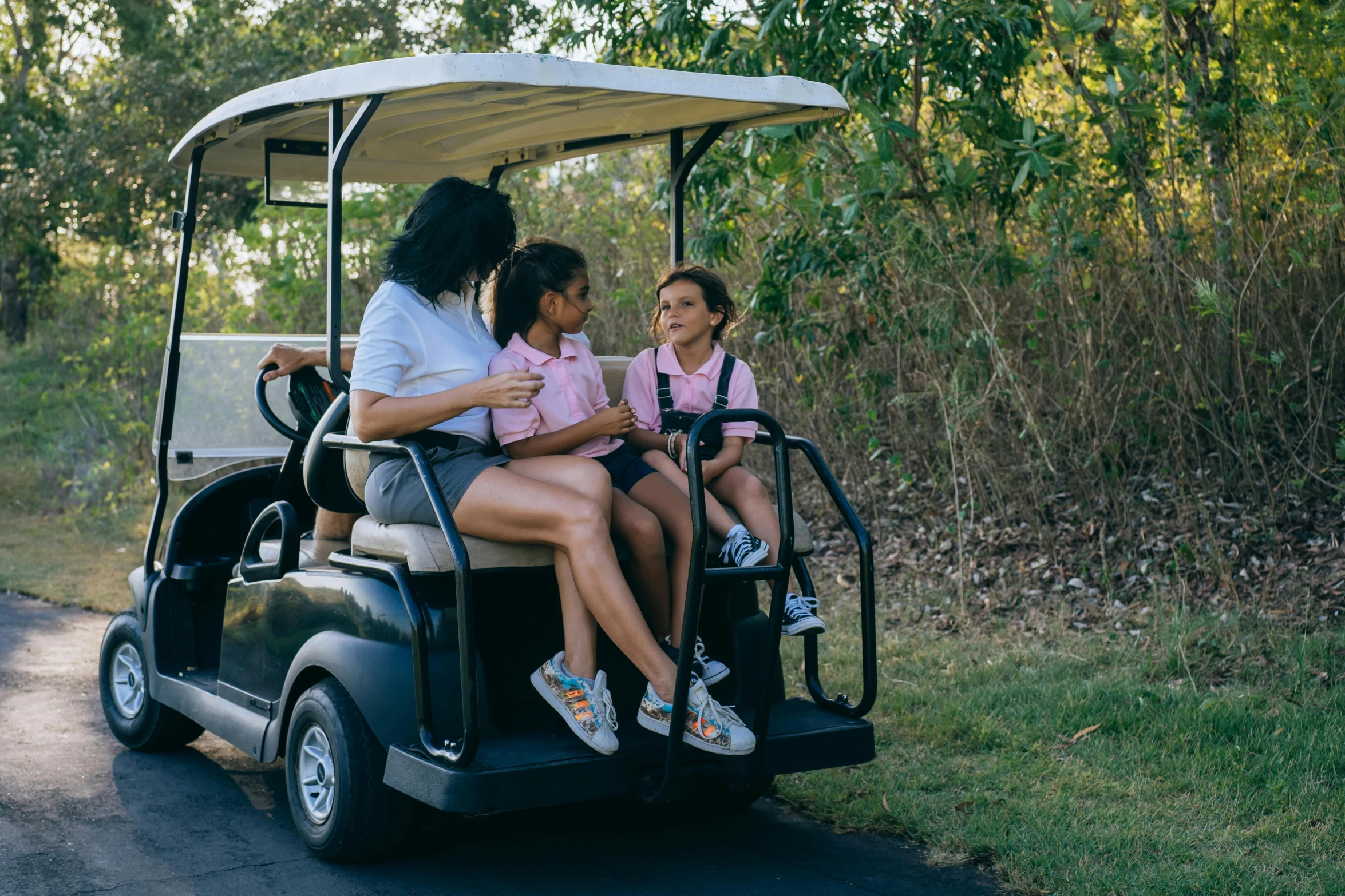 a group of people riding on top of a golf cart, isabela moner, private school, profile image, jen atkin