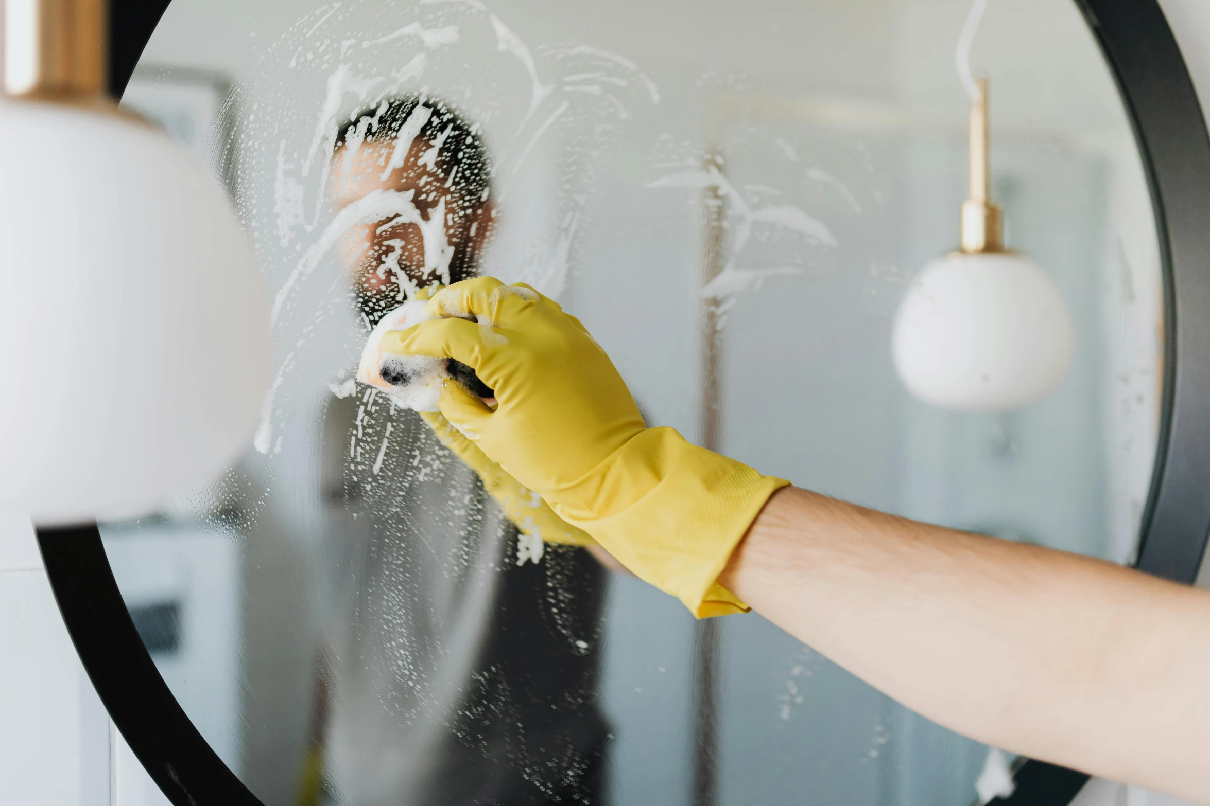 a person in yellow gloves cleaning a mirror, pexels, avatar image, splashing, full-body, as well as the handyboy