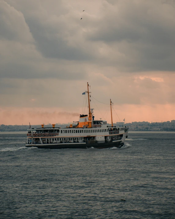 a large boat traveling across a large body of water, pexels contest winner, hurufiyya, istanbul, non-binary, sea queen, thumbnail