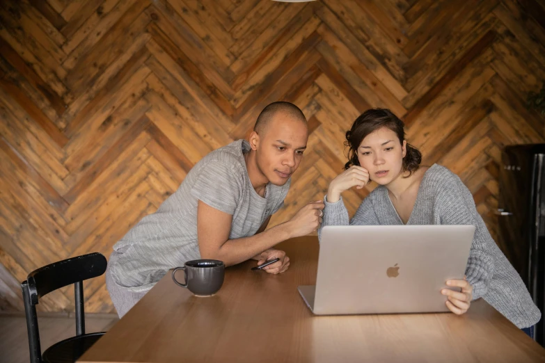 a couple of people sitting at a table with a laptop, by Everett Warner, pexels contest winner, ayami kojima and lyde caldwell, dwell, brown, desktop background