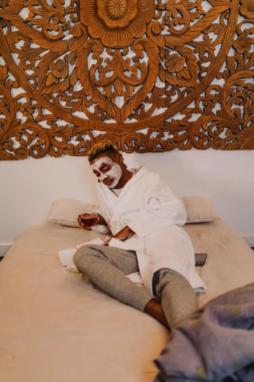 a man that is laying down on a bed, white face paint, full body shoot, spa, bruh moment