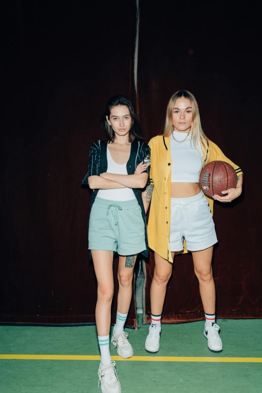 two women standing next to each other holding a basketball, inspired by Elsa Bleda, trending on dribble, bra and shorts streetwear, sydney sweeney, profile image, promotional image