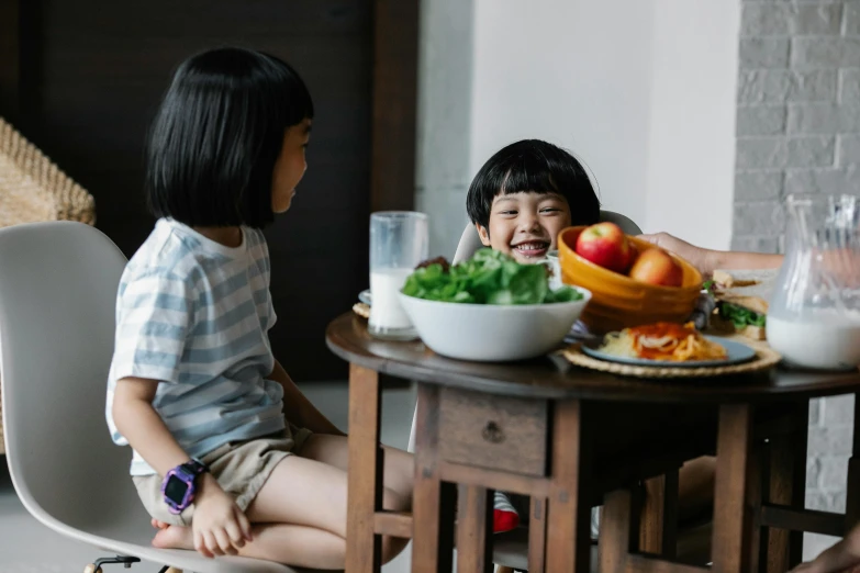 a couple of kids sitting at a table with food, pexels contest winner, healthy, joy ang, screensaver, high quality upload