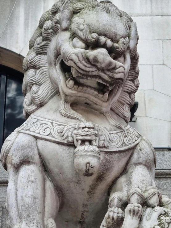 a stone lion statue in front of a building, inspired by Pu Hua, looking smug, great details, 2019 trending photo, in london