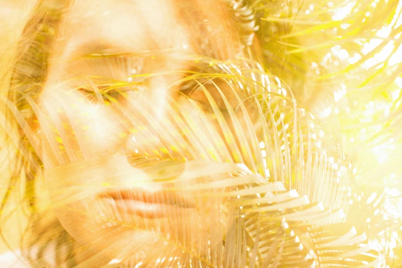 a close up of a person with long hair, by Ellen Gallagher, pexels, digital art, translucent leaves, golden rays, palms, double exposure portrait