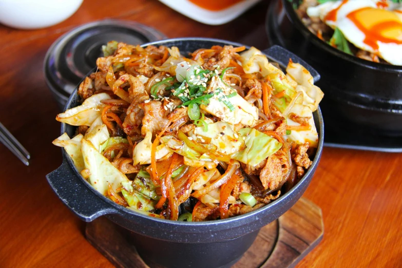 a close up of a bowl of food on a table, unsplash, mingei, fan favorite, meaty, square, pot