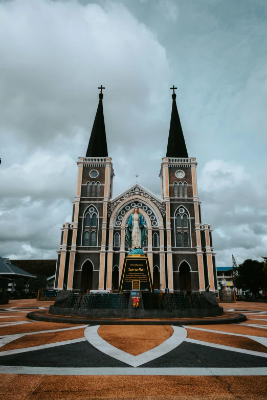 a church with a clock on the front of it, by Julia Pishtar, pexels contest winner, sumatraism, photographic isometric cathedral, square, colored, on a cloudy day