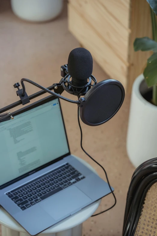 a laptop computer sitting on top of a table, microphones, thumbnail, detailed product image, growing