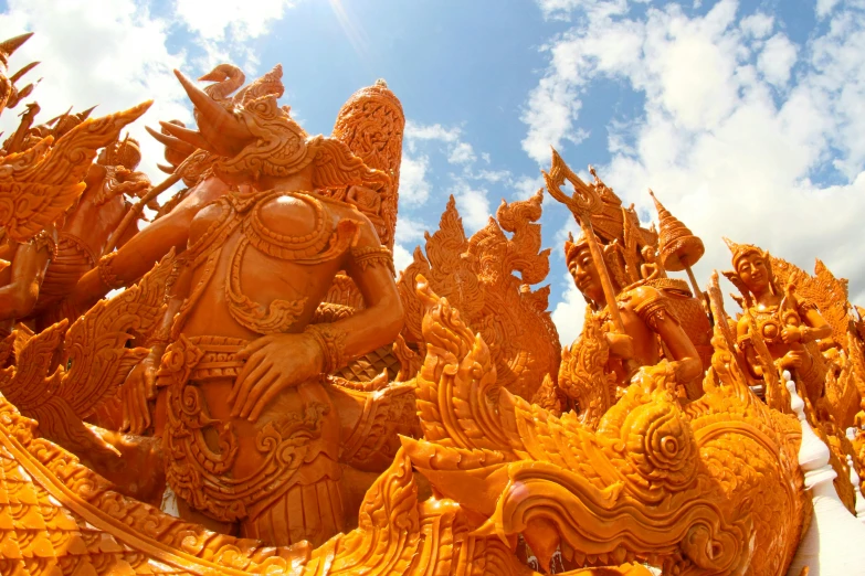 a statue of a group of people riding on top of a boat, orange skin. intricate, corn, sunshine, extremely detailed sand