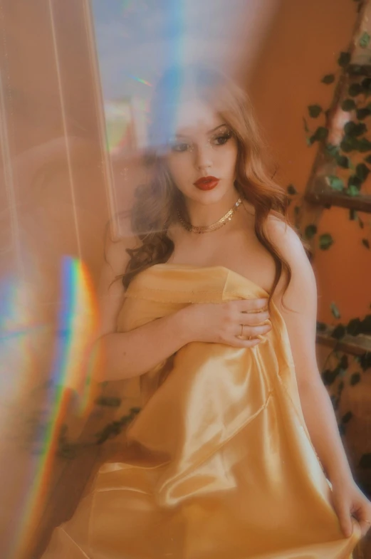 a woman in a yellow dress posing for a picture, an album cover, inspired by Elsa Bleda, trending on pexels, renaissance, loish and ross tran, diaphanous iridescent cloth, red gold hair, glossy photo