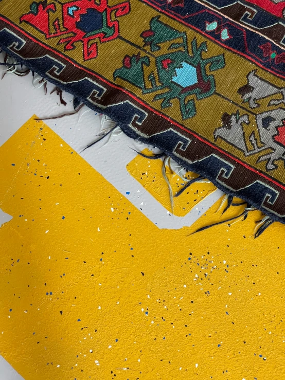 a pair of scissors sitting on top of a rug, by Carey Morris, graffiti, close-up print of fractured, yellow carpeted, rug, an unknown ethnographic object