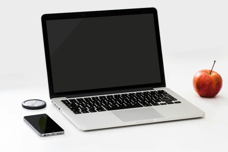 a laptop computer sitting on top of a desk next to an apple, a computer rendering, pexels, on a gray background, 9 9 designs, micropohone, islamic