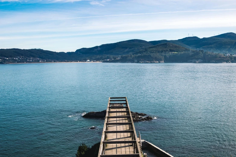 a pier in the middle of a large body of water, pexels contest winner, picton blue, bridges crossing the gap, 2 5 6 x 2 5 6 pixels, arrendajo in avila pinewood