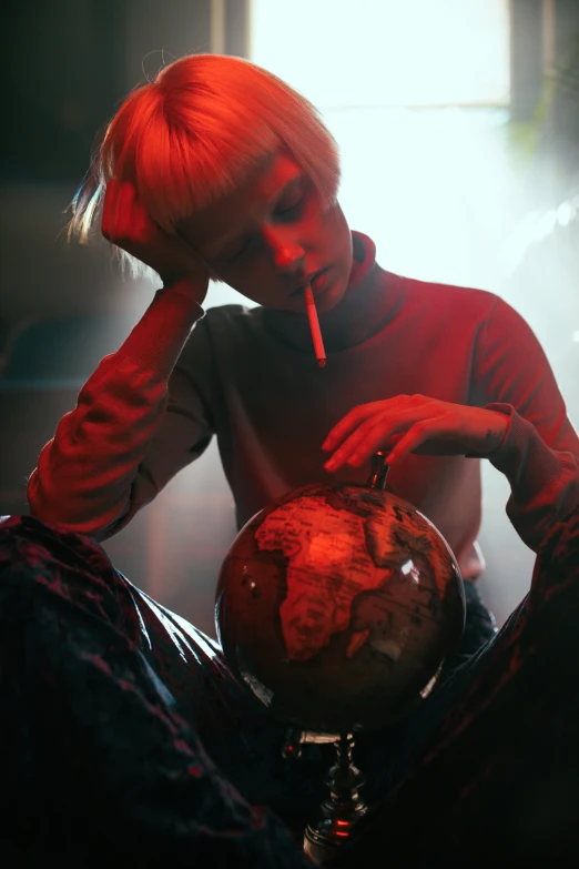 a woman sitting on the floor with a cigarette in her mouth, an album cover, inspired by Elsa Bleda, trending on pexels, surrealism, inside a globe, ganja, girl with short white hair, holding the earth