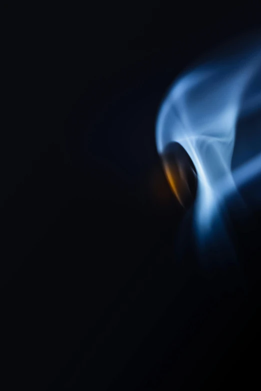 a close up of a car in the dark, a macro photograph, by Jan Rustem, art photography, small fire, blue, by joseph binder, swoosh