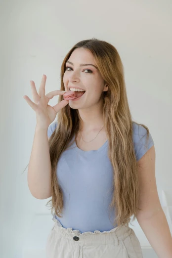 a woman standing in front of a mirror brushing her teeth, trending on pexels, renaissance, eating mars bar candy, with long hair, <pointé pose>;open mouth, on clear background