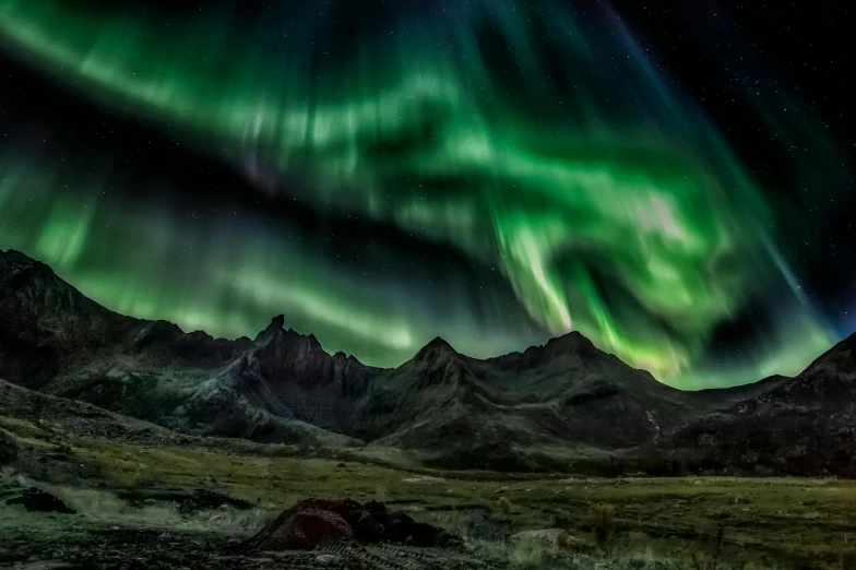 the northern lights in the sky above a mountain range, by national geographic, pexels contest winner, hurufiyya, grey, ultrawide lens”, 4k”, electric colours