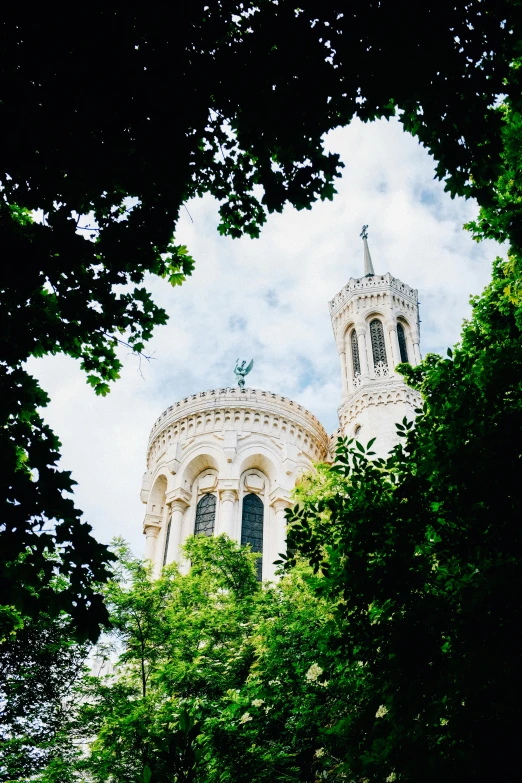 a view of a church through the trees, inspired by Albert Paris Gütersloh, trending on unsplash, romanesque, neoclassical tower with dome, a blond, lots de details, paris