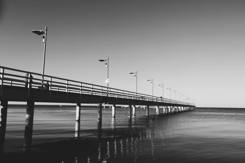 a black and white photo of a pier, a black and white photo, pexels contest winner, 15081959 21121991 01012000 4k, instagram post, brown, monochrome background