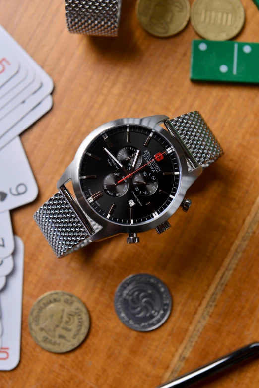 a watch sitting on top of a wooden table, a portrait, thumbnail, black and silver, crosshatch, poker