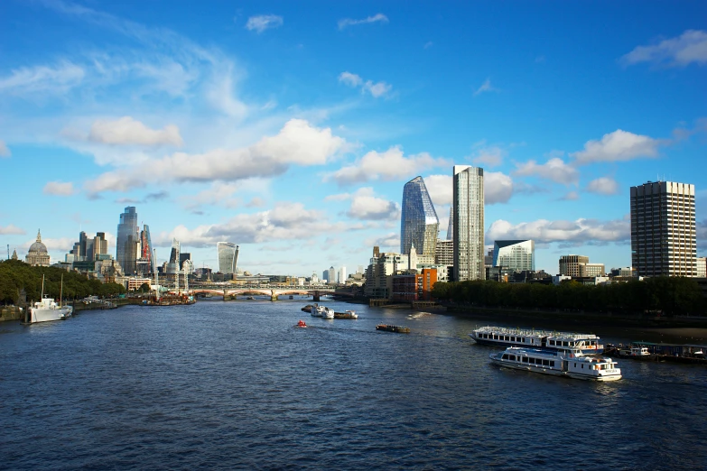 a river filled with lots of boats next to tall buildings, a picture, by Christopher Wren, sunny day time, thumbnail, skyline showing, eal