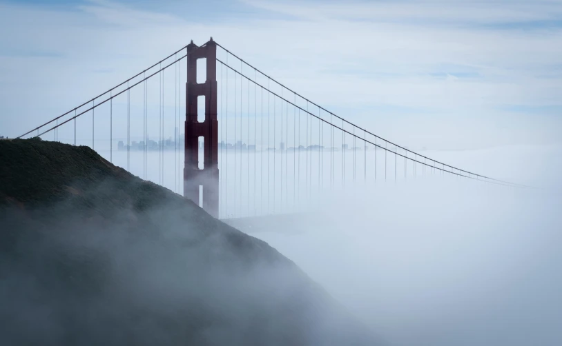 a view of the golden gate bridge in the fog, by Matt Stewart, pexels contest winner, medium format, cyan fog, fog mads berg, slide show