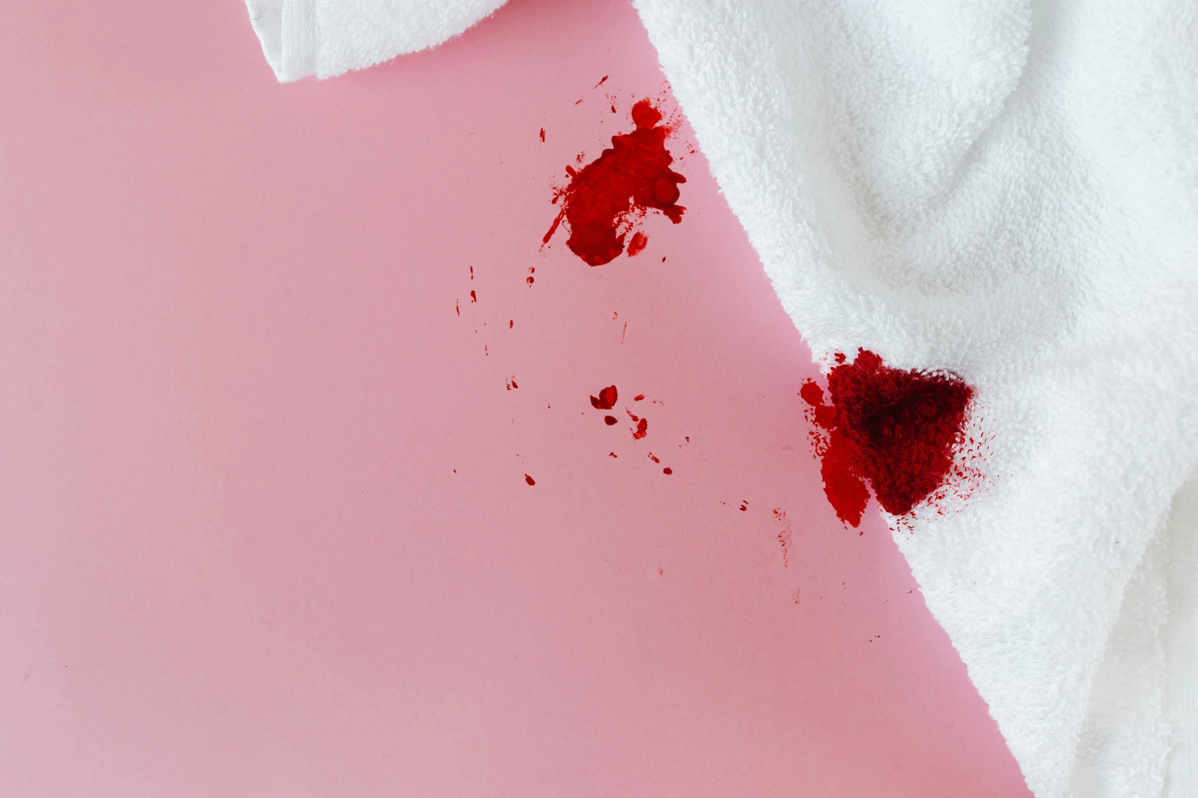 a white towel with a blood stain on it, trending on pexels, hurufiyya, crimson themed, injured, shooting, white and pink cloth