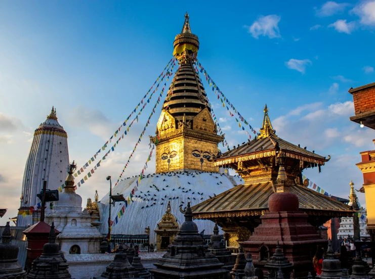 a group of buildings that are next to each other, pexels contest winner, cloisonnism, nepali architecture buildings, black domes and spires, golden light, square