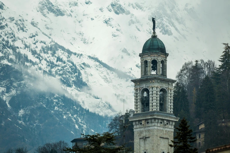 a clock tower in front of a snowy mountain, pexels contest winner, baroque, curvy build, holy, cinematic still