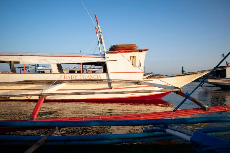 a boat sitting on top of a body of water, a portrait, manila, fan favorite, exterior, heavy lines