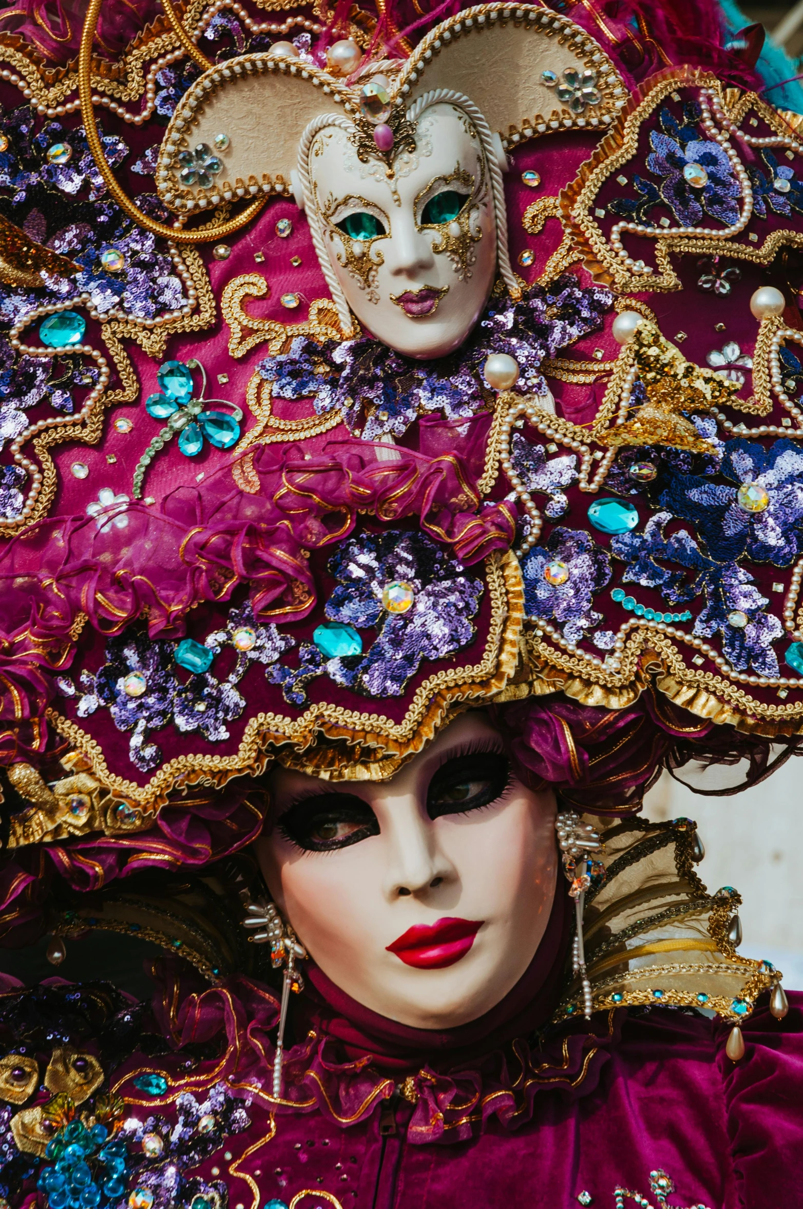 a close up of a person wearing a costume, inspired by Quirizio di Giovanni da Murano, pexels contest winner, gorgeous and huge head ornaments, magenta colours, square, both faces visible