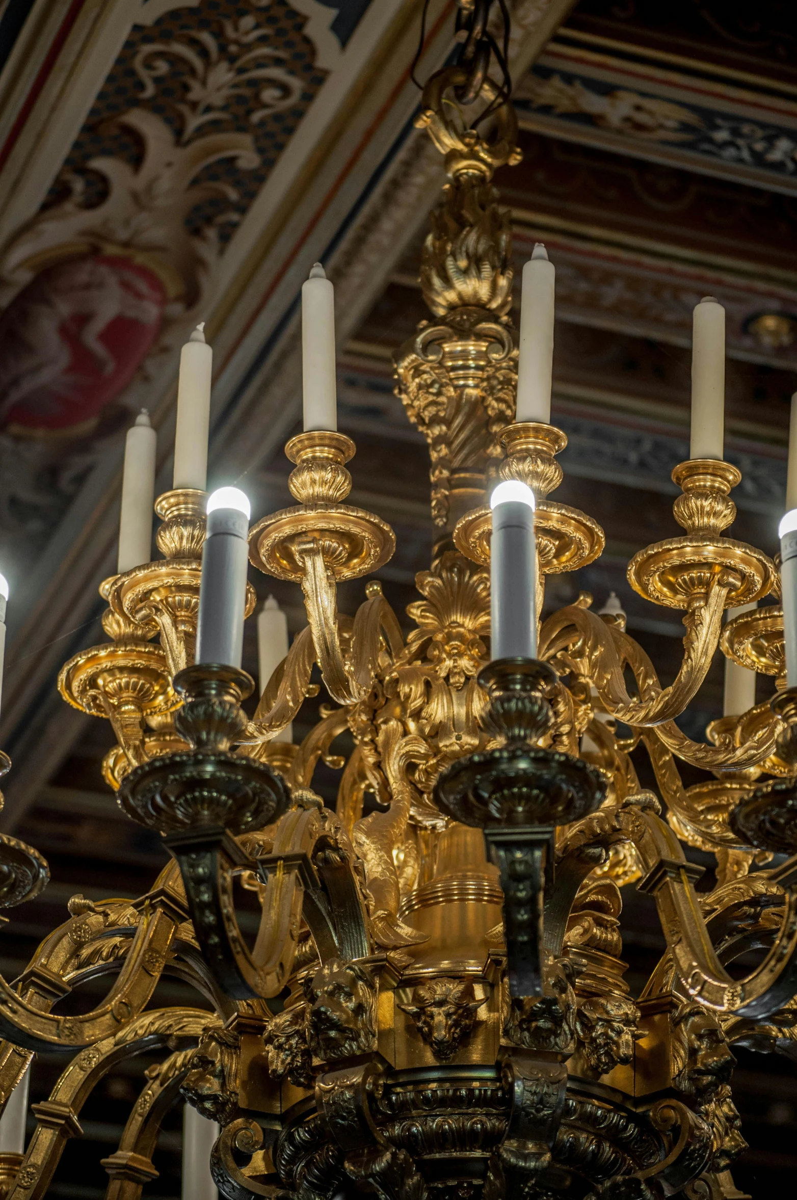 a close up of a chandelier with candles, by Gian Lorenzo Bernini, gold decorations, light show