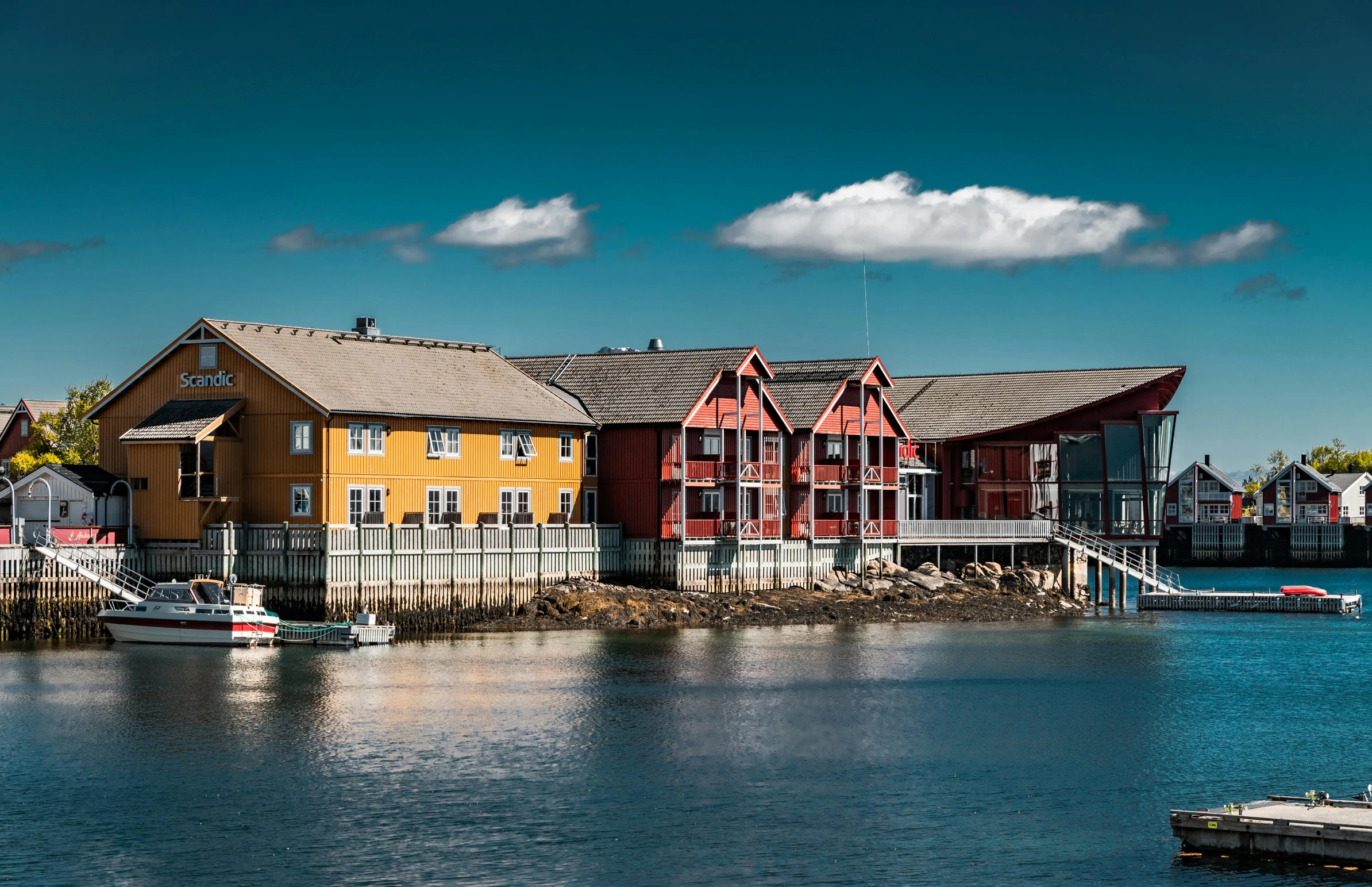 a row of houses next to a body of water, a picture, inspired by Wilhelm Marstrand, pexels contest winner, complementary colour, shipyard, exterior view, corona renderer
