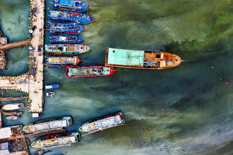 a group of boats sitting on top of a body of water, by Dan Christensen, pexels contest winner, guangjian huang, flatlay, intense color, thumbnail