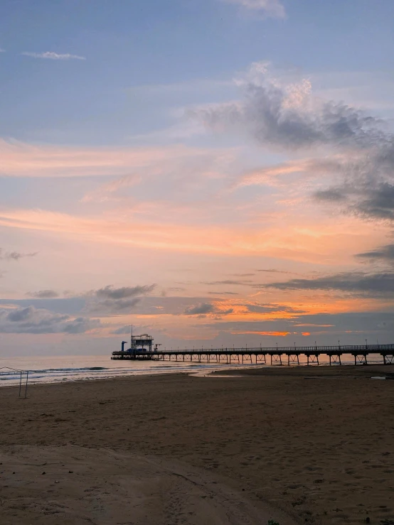 a man flying a kite on top of a sandy beach, by Jan Tengnagel, unsplash contest winner, romanticism, sunset panorama, boardwalk, thumbnail, profile image