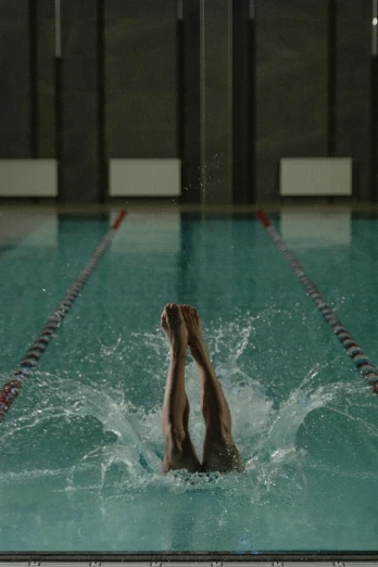 a close up of a person swimming in a pool, leaping towards viewer, award winning cinematic still, **cinematic, ignant