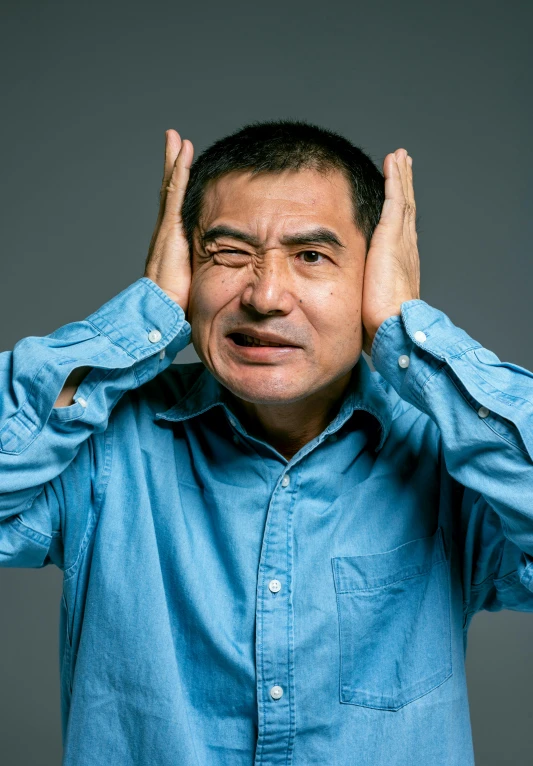 a man covering his ears with his hands, by Tadashi Nakayama, an film still of mr bean, asian face, noise effect, 千 葉 雄 大