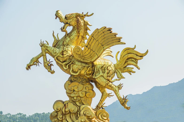 a golden statue of a dragon on top of a mountain, inspired by Pu Hua, pexels contest winner, baroque, horse is up on its hind legs, public art, guangjian, ukiyo - e sculpture