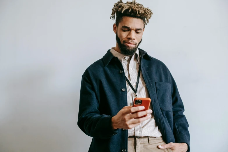 a man with dreadlocks looking at his cell phone, trending on pexels, renaissance, wearing a bomber jacket, wearing wool suit, wearing a dark blue polo shirt, lean man with light tan skin