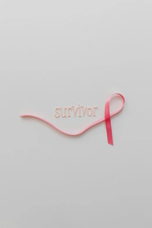a pink ribbon with the word survivor on it, by Olivia Peguero, laser cut, 2 0 1 9, 王琛, victoria siemer