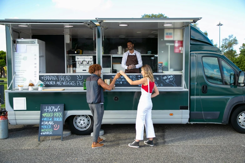 a couple of people standing in front of a food truck, square, high quality image, thumbnail, coastal