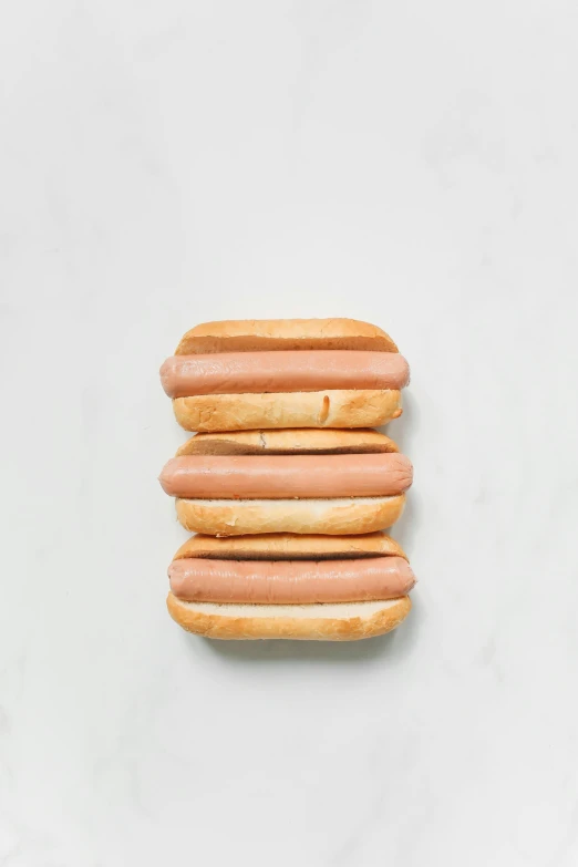 a bunch of hot dogs stacked on top of each other, a portrait, unsplash, 35 mm product photo”, beige mist, 6 pack, matte finish