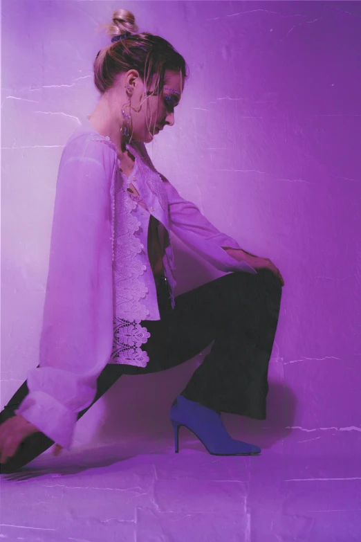 a woman sitting on the ground wearing high heels, an album cover, inspired by Elsa Bleda, aestheticism, ((purple)), androgynous person, bleached, bad bunny