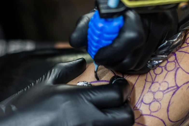 a man getting a tattoo on his arm, a tattoo, by Adam Marczyński, trending on pexels, blue veins, neon ink, black ink outline, 2717433015
