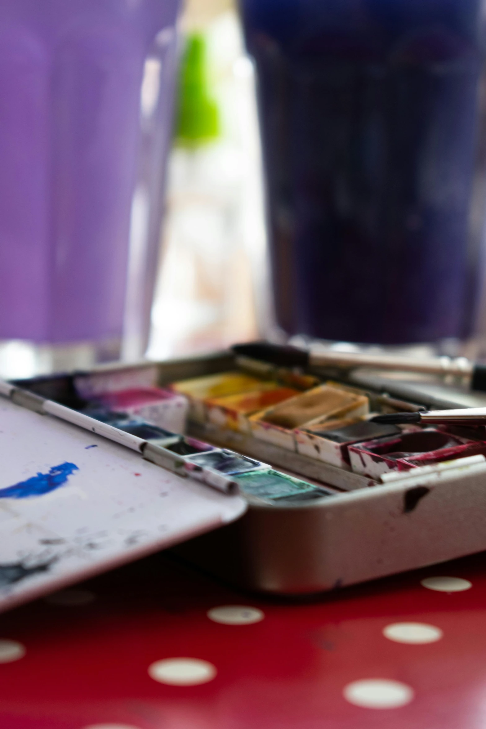 a box of paint sitting on top of a table, a watercolor painting, pexels, purple palette, ((water color))