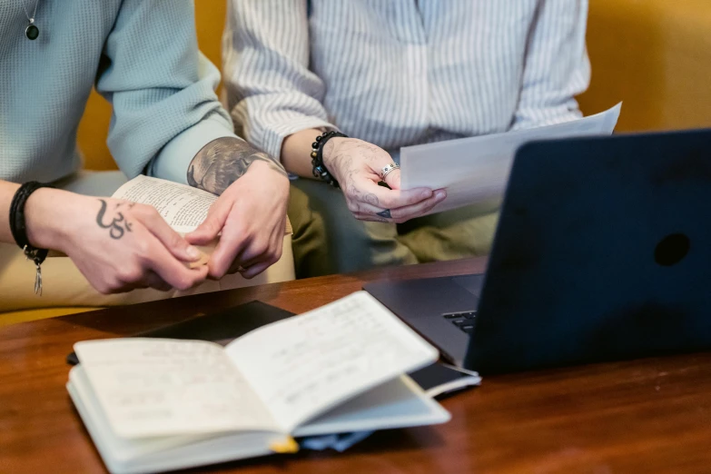 a couple of people that are sitting in front of a laptop, unsplash, academic art, manuscript, government archive photograph, background image, lachlan bailey