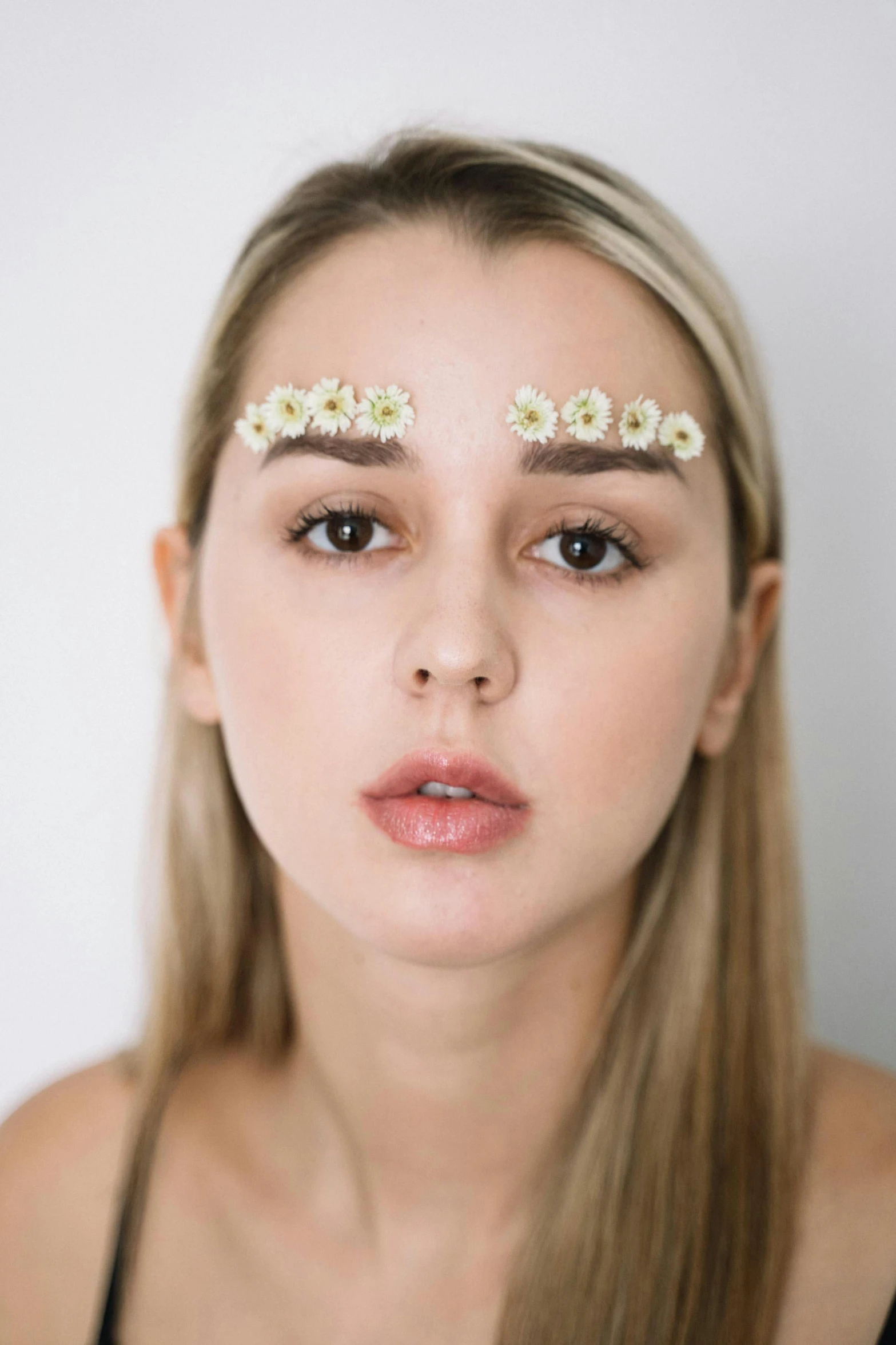 a woman with flowers in her hair, an album cover, inspired by Elsa Bleda, trending on pexels, hyperrealism, big eyebrows, sydney sweeney, hyperrealistic teen, ava max