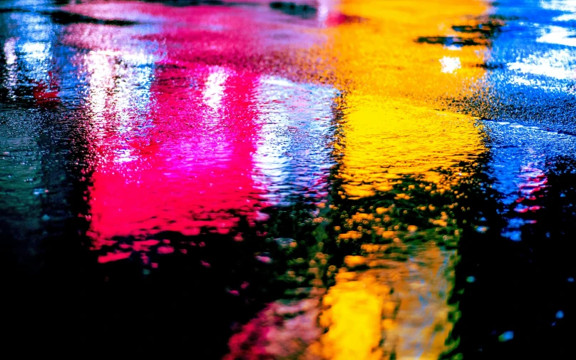 a city street filled with lots of colorful lights, by Julia Pishtar, unsplash contest winner, neo-fauvism, rain water reflections in ground, wet metal reflections, high-contrast, closeup