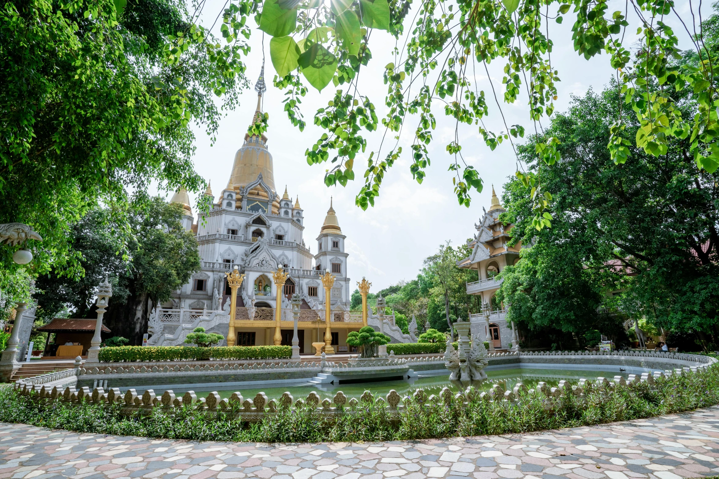 a large white building surrounded by trees, pexels contest winner, vietnamese temple scene, profile image, beautiful gold saint, 90s photo